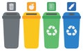 Four colored recycling bins.