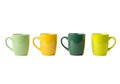 Four colorful ceramic mugs displayed in a neat row against a plain background Royalty Free Stock Photo