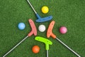 Four Mini Golf Putters with Balls Royalty Free Stock Photo