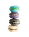 Four colorful macarons in stack isolated on white. Gourmet dessert concept