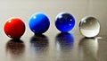 Four colorful marbles on a row Royalty Free Stock Photo
