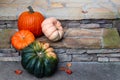 Four colorful pumpkins decorating the front porch in fall