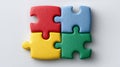 Four colorful puzzle pieces connected on a plain background. Royalty Free Stock Photo
