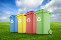 Four colorful recycle bins