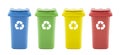 Four colorful recycle bins