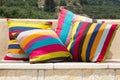 Four colorful striped pillows