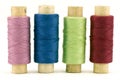 Four colorful thread spools Royalty Free Stock Photo