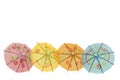 Four colorfull cocktail umbrellaÃ¢â¬â¢s isolated against white background Royalty Free Stock Photo