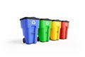 Four colorfull plastic garbage bins with recycling logo, staked on row.