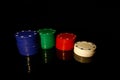 Four colors of casino chips stack : blue, green, red white  on black with reflection Royalty Free Stock Photo