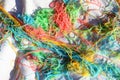 Mess of colored noodles on white cloth