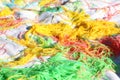 Mess of colored noodles on white cloth