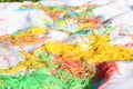 Mess of colored noodles on white cloth