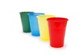 Four colourful plastic cups