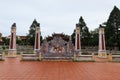 Four columns and decorated wall in the courtyard of the Van Mieu Confucius Temple. Hoi An, Vietnam