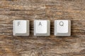 Four computer keyboard keys arranged to spell FAQ word Royalty Free Stock Photo