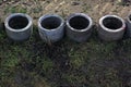 Four concrete drainage pipes