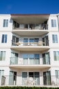 Four Condo Balconies Under Blue