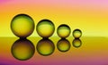 Four crystal balls in a row with colorful streaks of rainbow color behind them Royalty Free Stock Photo