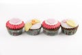Four cupcakes isolated on white background