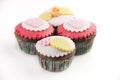 Four cupcakes on white background