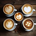 Four Cups of Cappuccino on Wooden Table Royalty Free Stock Photo