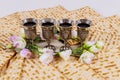 Four cups full of wine with matzah. Jewish holidays Passover