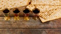 Four cups full of wine with matzah. Jewish holidays Passover