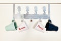 Four cups hanging on a door coat rack with bonjour word in french Royalty Free Stock Photo