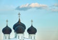 Four dark blue domes on top of the christian church with a sky background Royalty Free Stock Photo