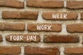 Four-day work week symbol. Concept words Four-day work week on brick wall. Beautiful brick wall background. Business and Four-day