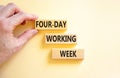 Four-day working week symbol. Concept words Four-day working week on wooden block on a beautiful white table white background. Royalty Free Stock Photo