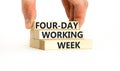 Four-day working week symbol. Concept words Four-day working week on wooden block on a beautiful white table white background. Royalty Free Stock Photo