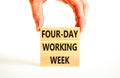 Four-day working week symbol. Concept words Four-day working week on wooden block on a beautiful white table white background. Royalty Free Stock Photo