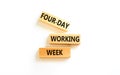 Four-day working week symbol. Concept words Four-day working week on wooden block on a beautiful white table white background. Royalty Free Stock Photo