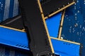 Four DDR memory chips in different colors lying on a blue printed circuit board. Royalty Free Stock Photo