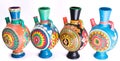 Four decorated colorful handcrafted pottery jugs Royalty Free Stock Photo