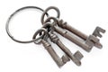 Four decorative antique brown metal keys on a large ring Royalty Free Stock Photo