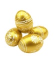 Four Decorative Golden Easter Eggs with White Floral Patterns on a White Background image photo Royalty Free Stock Photo