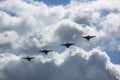 Four destroyers on airshow in white clouds Royalty Free Stock Photo