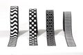 Four different black and white elastic ribbons