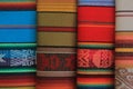 Four different carpets of a colorful South American design usually found in the Andes of Peru and Ecuador