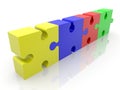 Four different colored puzzle pieces in one row Royalty Free Stock Photo