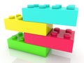 Four different colored toy bricks on top of each other Royalty Free Stock Photo