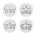 Four different king crowns with rays. Engraving vintage vector black illustration Royalty Free Stock Photo