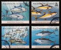 Four different species of tuna on a series of stamps