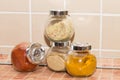 Four different spices in jars Royalty Free Stock Photo