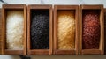 Four different types of rice in wooden boxes on a marble surface Royalty Free Stock Photo