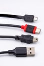 Four different USB plugs and cables Royalty Free Stock Photo