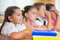 Four diligent pupils studying at classroom Royalty Free Stock Photo